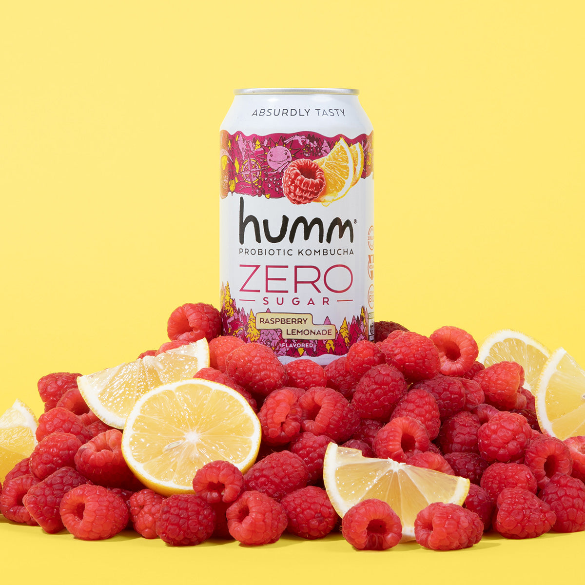 can of kombucha on top of raspberries