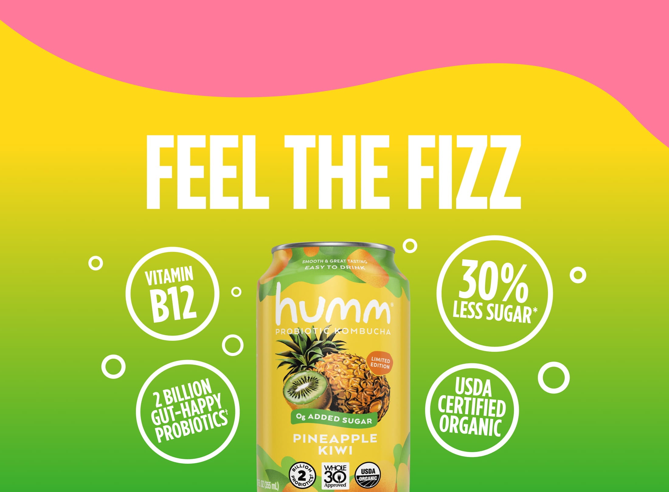 A promotional image for Humm Probiotic Kombucha featuring a Pineapple Kiwi flavor can on a yellow and green background with pink accents. The can highlights "30% Less Sugar," "2 Billion Gut-Happy Probiotics," "Vitamin B12," "0g Added Sugar," and "USDA Certified Organic." Large white text above reads, "FEEL THE FIZZ," with fruit graphics and bubbles surrounding the can.