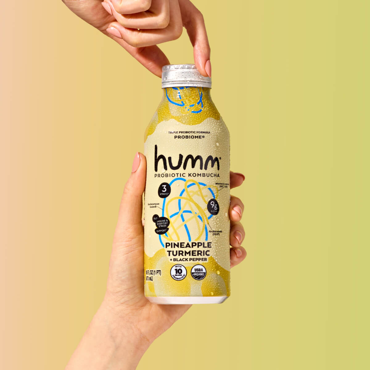 bottle of probiome with a hand